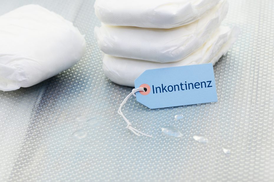 Schild auf dem Inkontinenz zu lesen ist, Inkontinenz-Einlagen